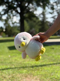 Holding Puddles the Pink Penguin - Cuddle Cart